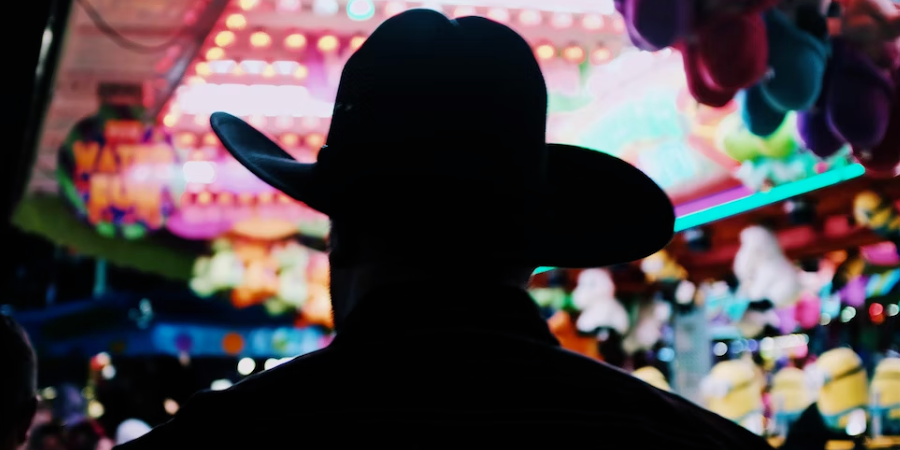 Silhouette of a man wearing a cowboy hat