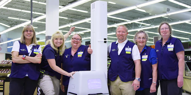 Walmart puts robots to work with humans in more stores