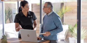 Best Buy Geek Squad member speaking with man