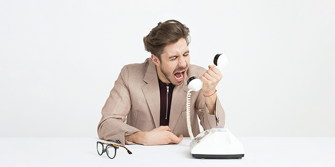 Angry person yelling at phone