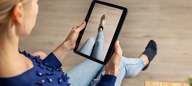 virtual fitting room - woman trying on shoes online with digital tablet