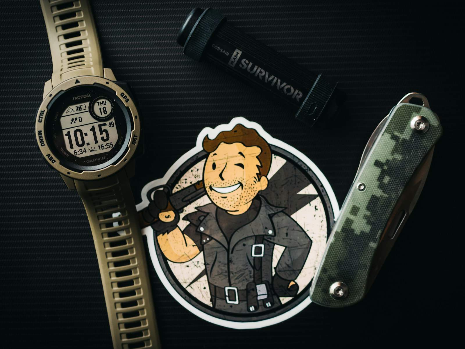 a watch and a fallout sticker with a picture of a man