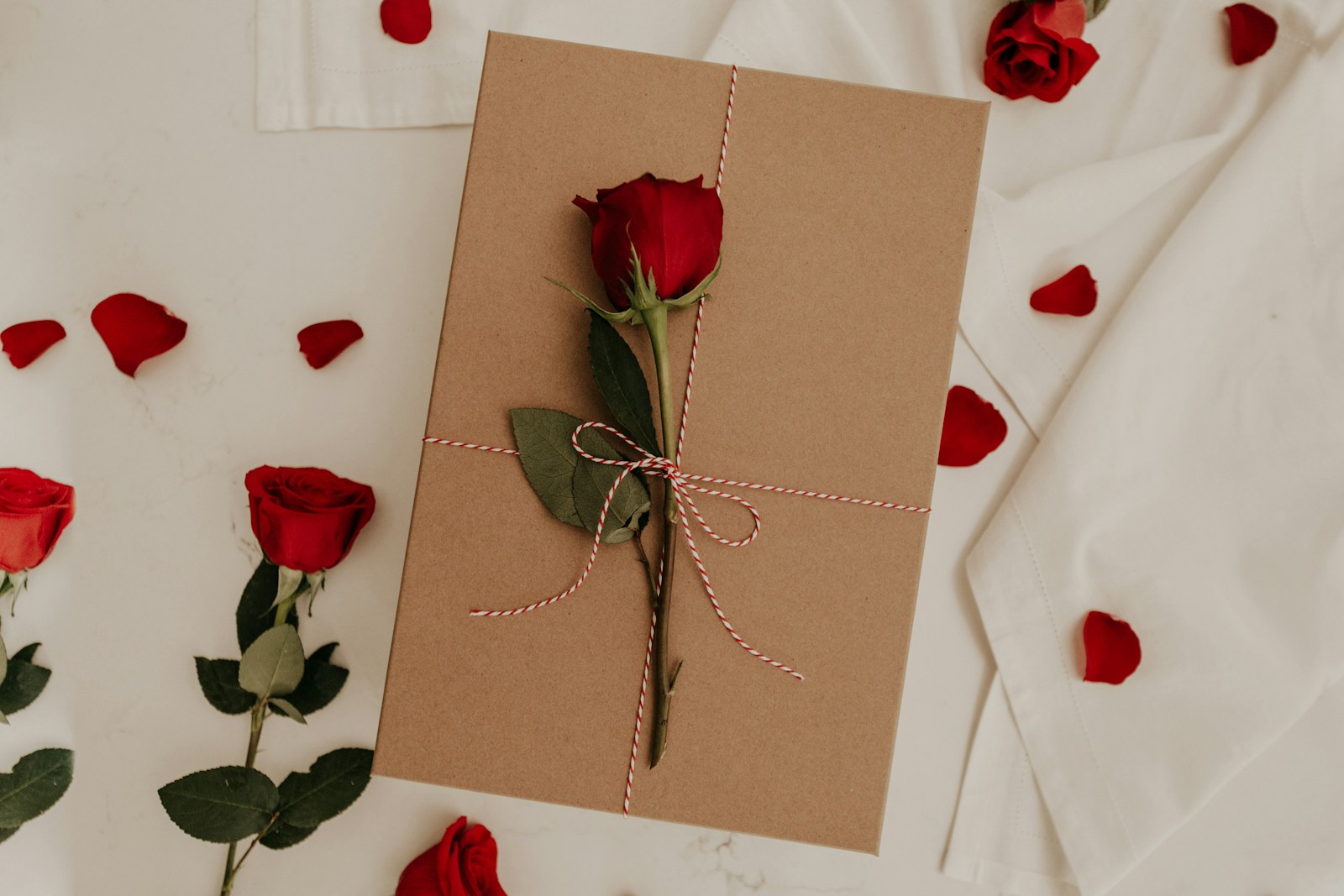 red rose on brown envelope valentine's day proxy