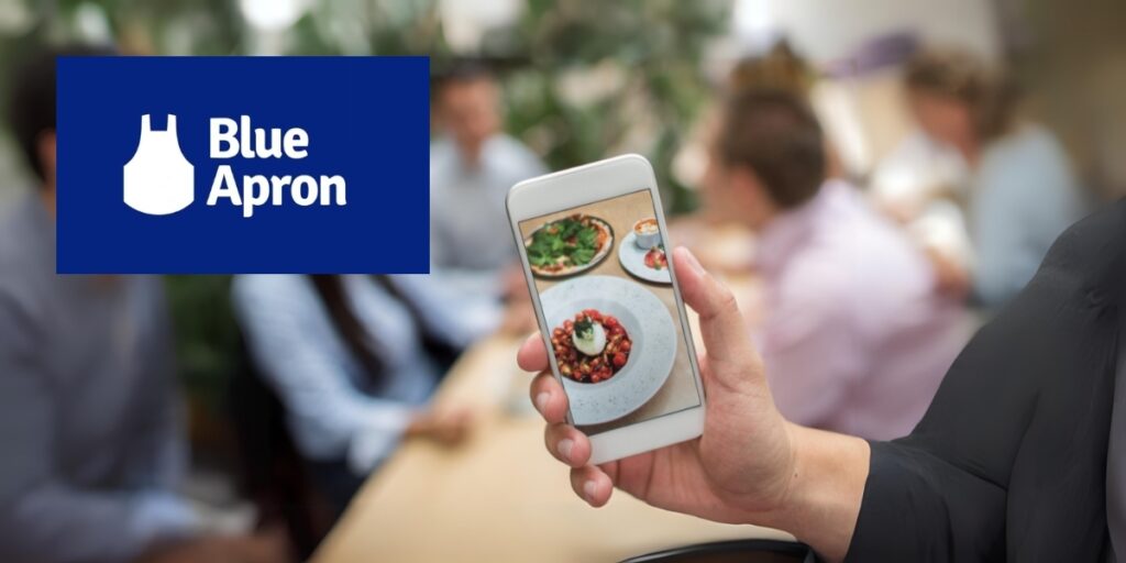 Image of a phone with plated food on it next to a Blue Apron logo