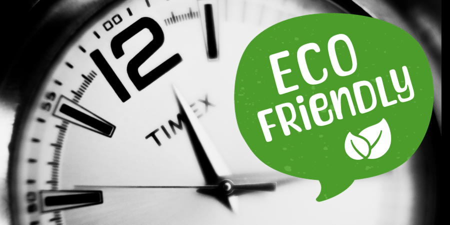 Close-up of a watch face with the words "eco friendly" on top