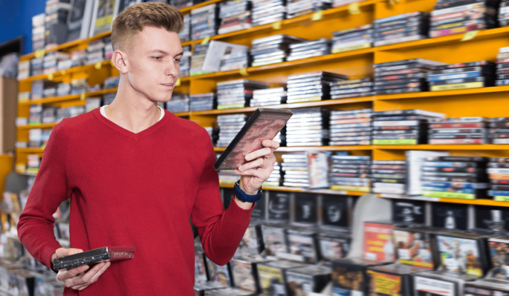 Man picking out DVDs