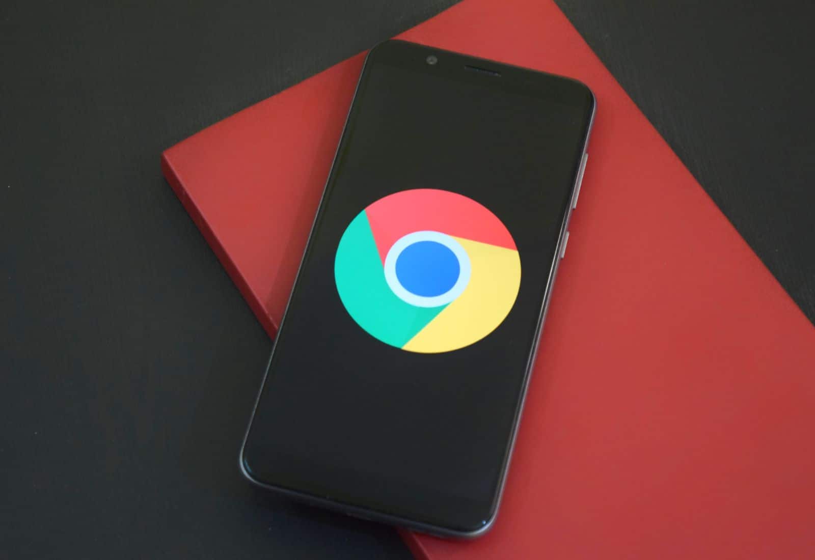 The Google Chrome browser logo appears on a smartphone.