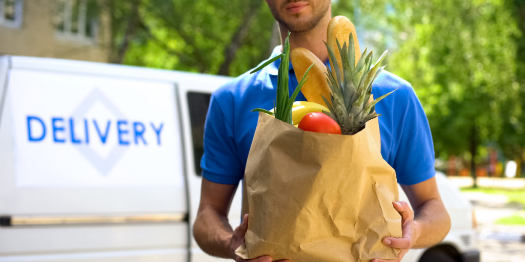 Man dropping off a grocery delivery