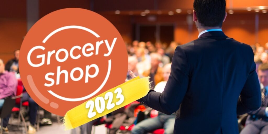 Image a speaker talking to an audience with the "Groceryshop 2023" logo on top