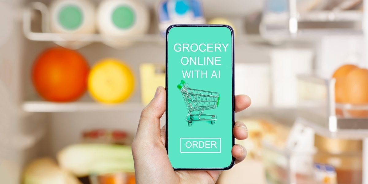 Hand holding a phone with the words "Grocery online with AI" and "Order" on the front