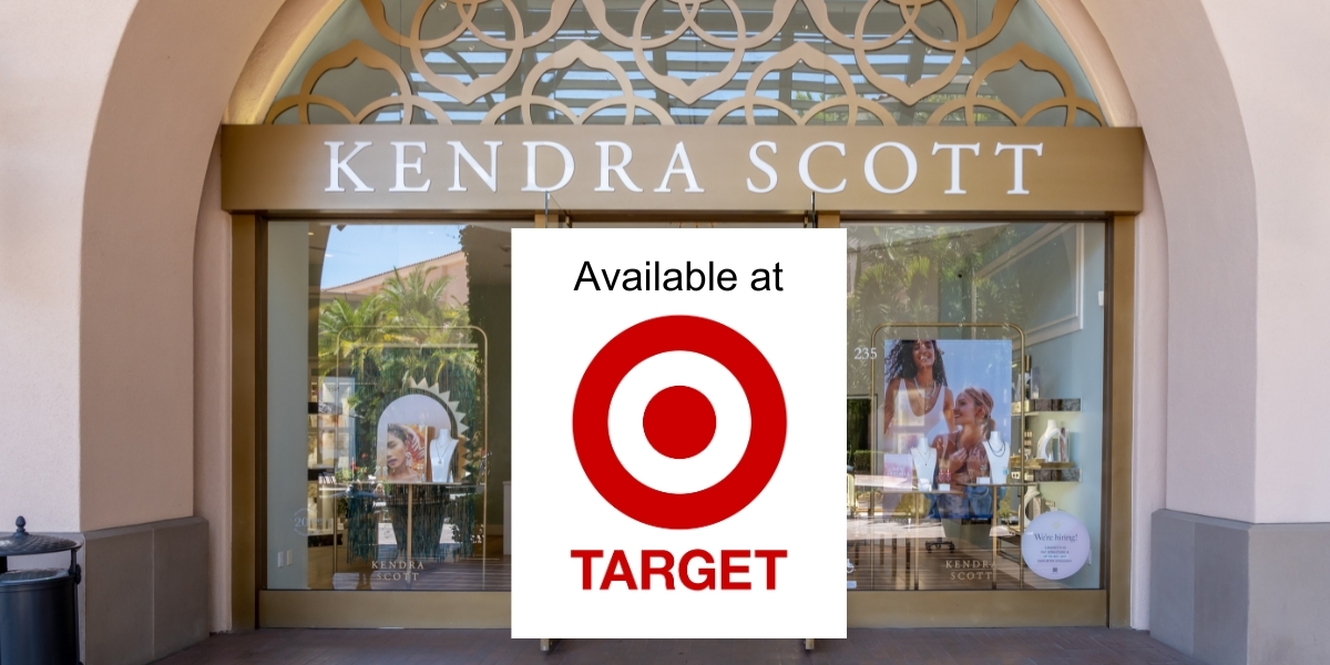 Front of a Kendra Scott store with a sticker on top that says "Available at Target"
