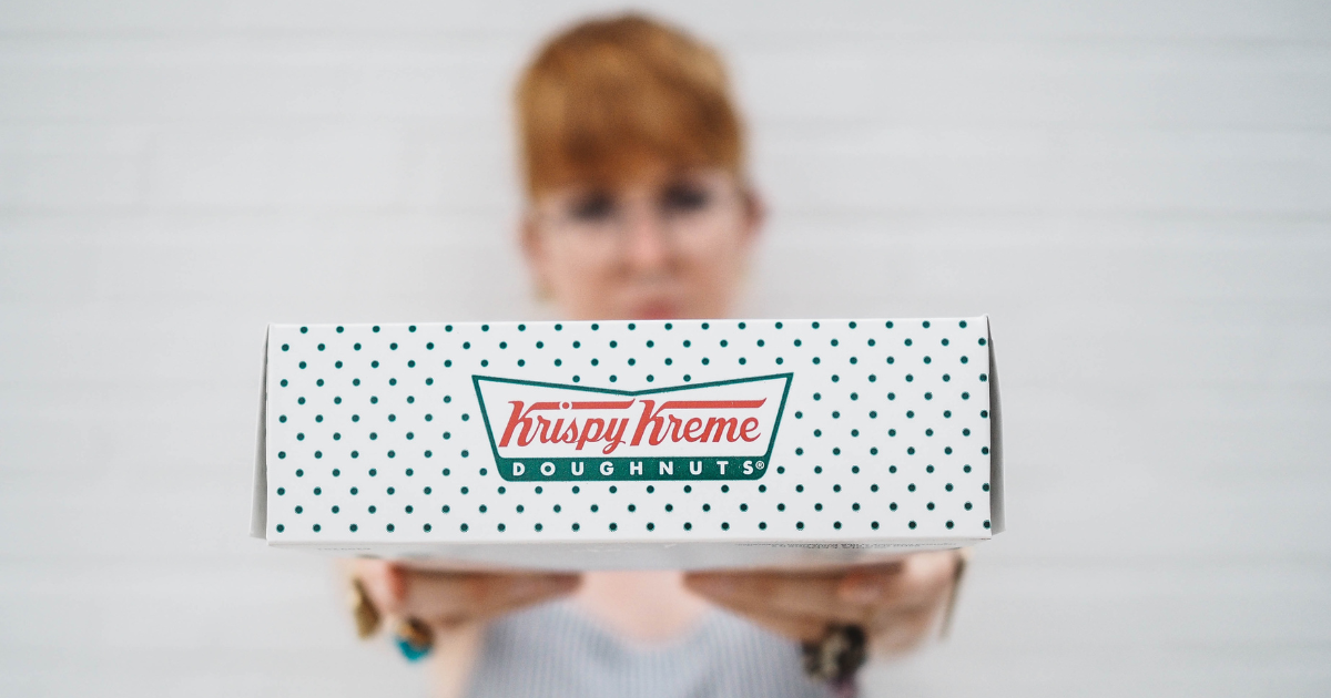 Woman holding Krispy Kreme box