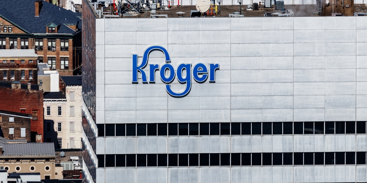 Outside of a building with the name "Kroger" on it