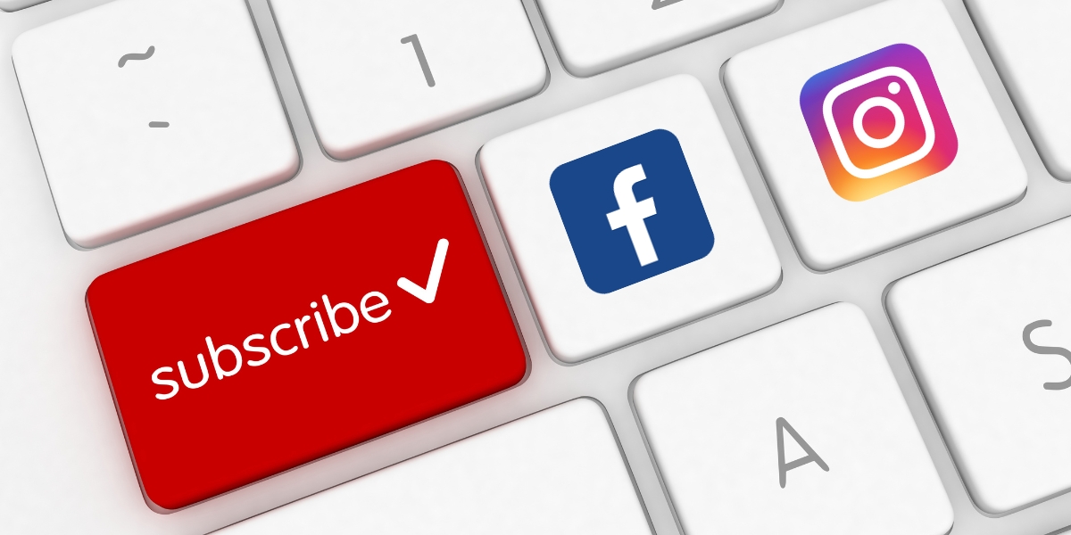 Close-up of a keyboard with the word "subscribe" next to the Facebook and Instagram logos