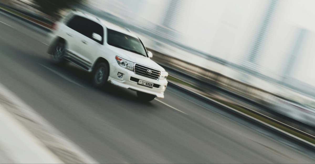 A white Toyota Sequoia on the road.
