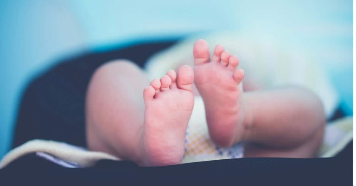 A baby wearing a disposable diaper