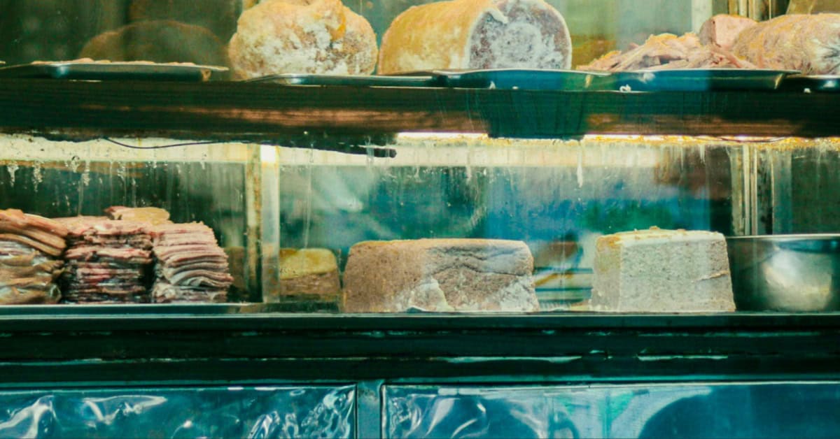 A selection of cold cuts in a display case