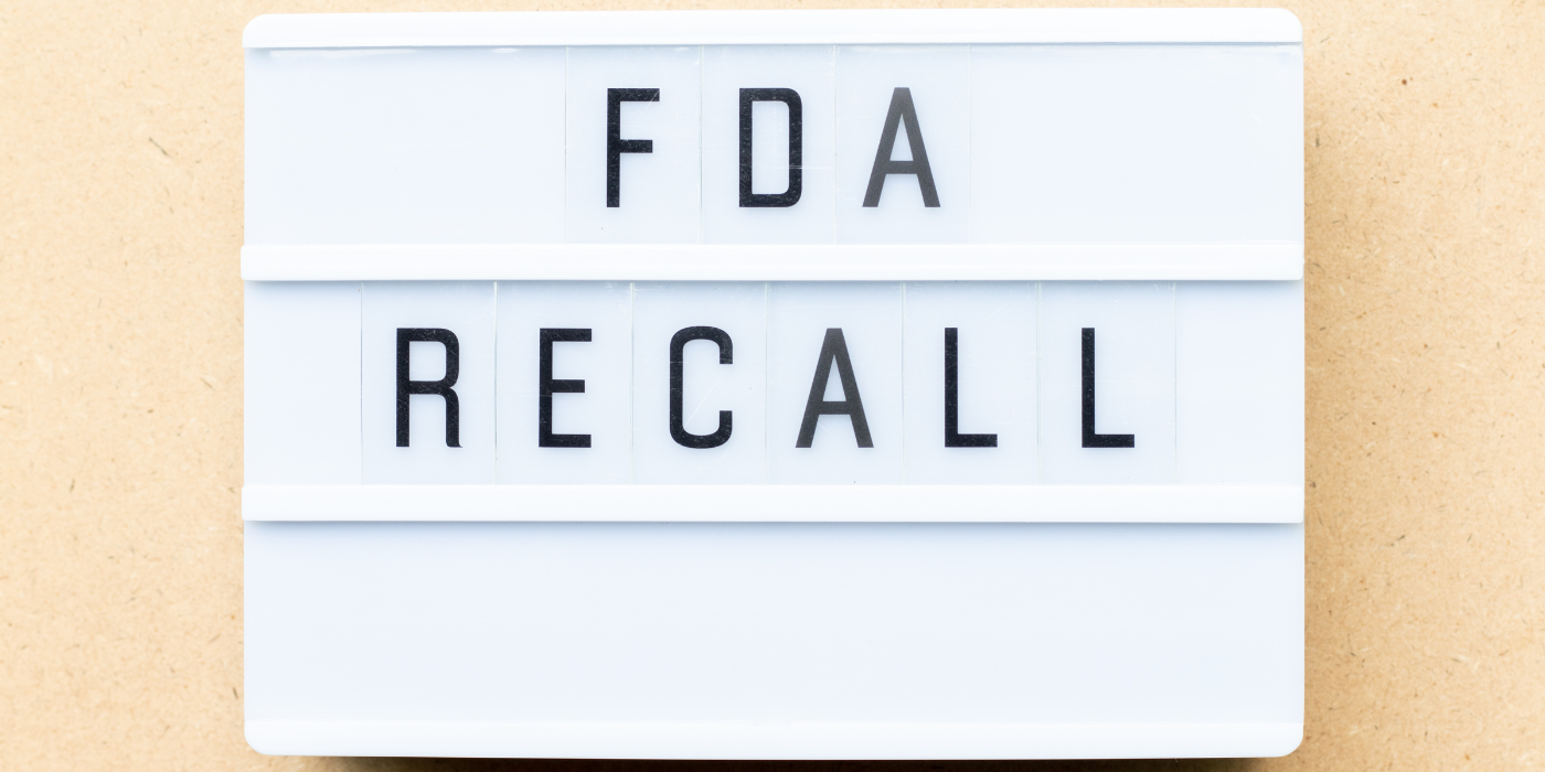 The words "FDA Recall" on a board