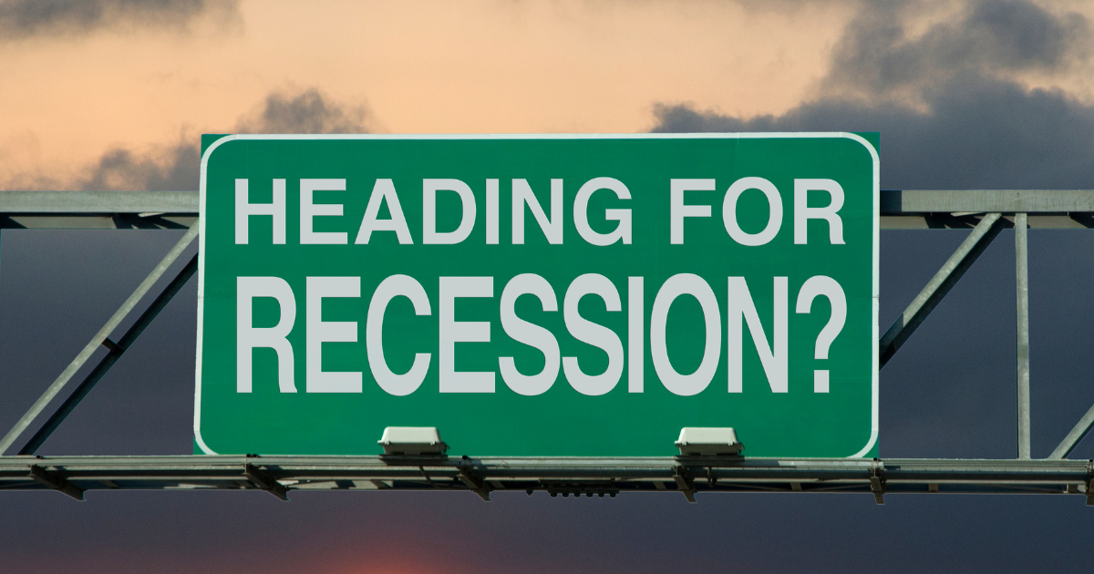 A sign with the words "Heading for recession?"
