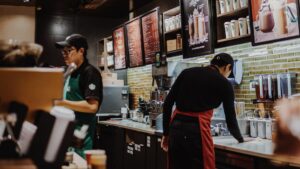 Starbucks baristas behind the counter