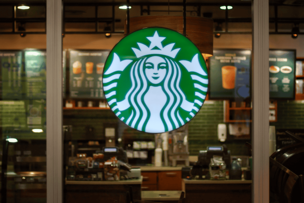Starbucks logo in front of a window