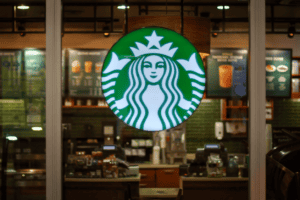 Starbucks logo in front of a window