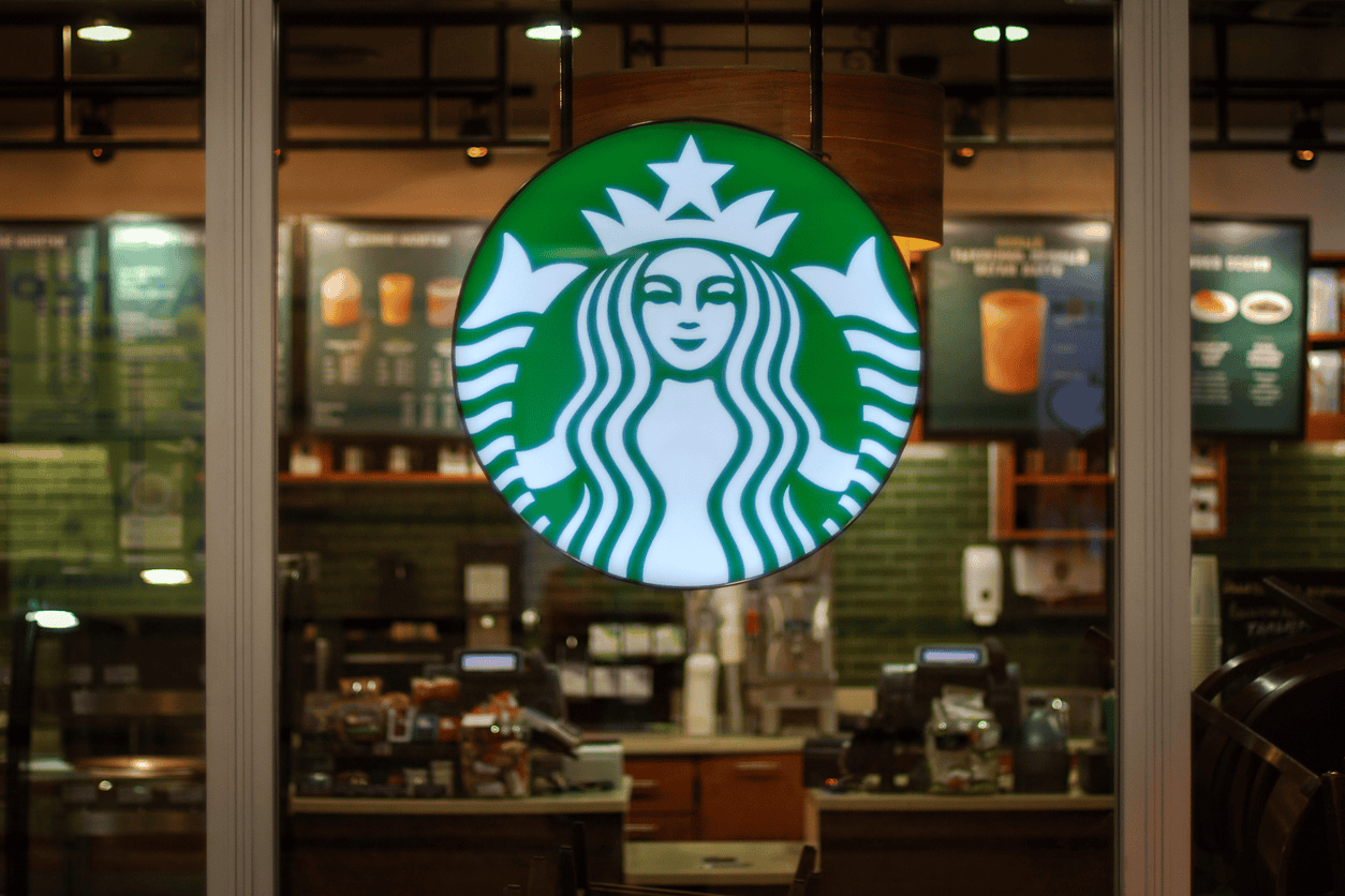 Starbucks logo in front of a window