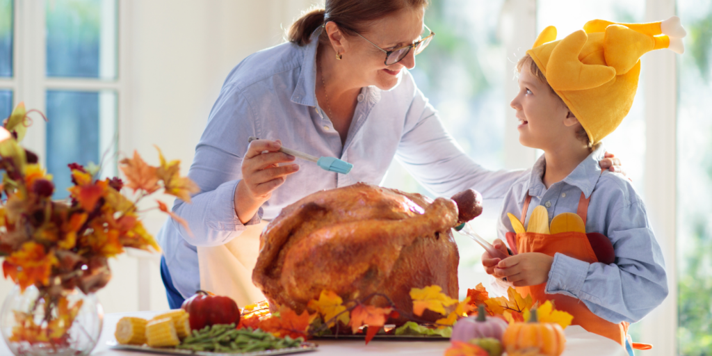 Woman and child cooking a turkey