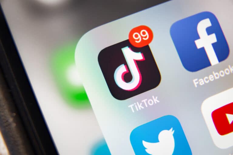 TikTok and Facebook application on iPhone screen
