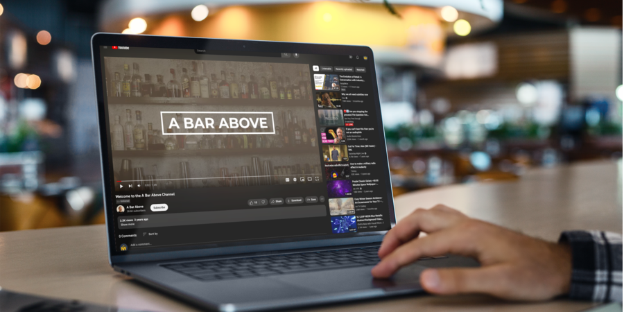 Laptop opened to "A Bar Above" channel on YouTube