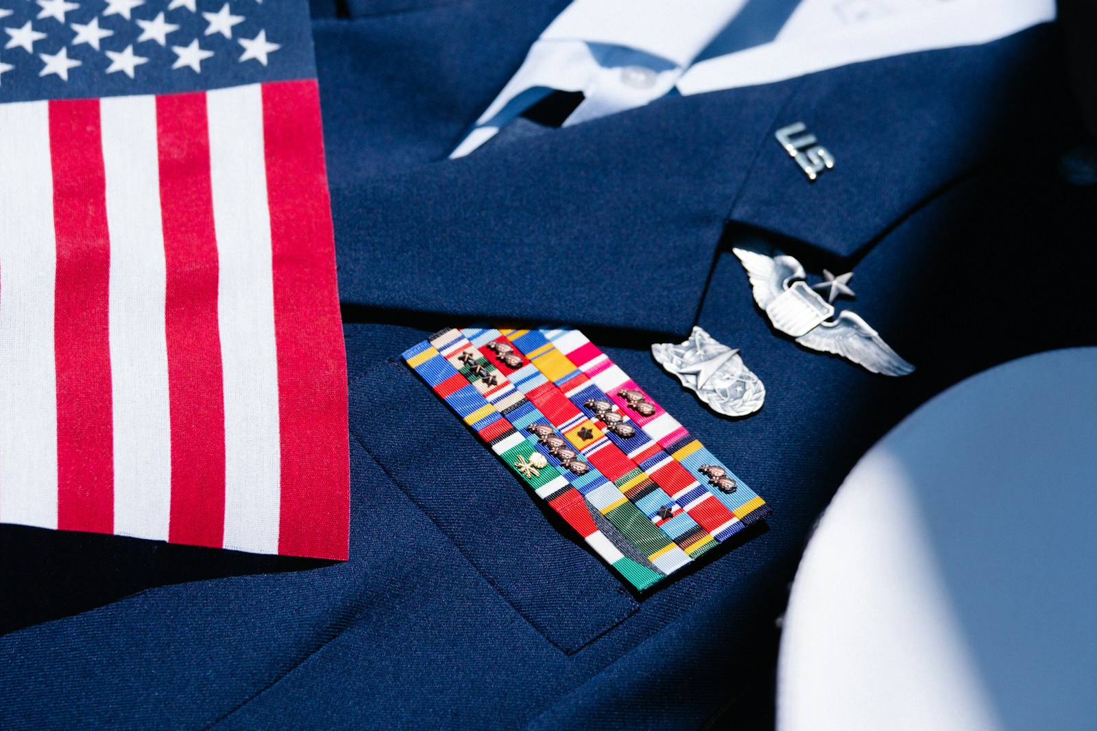 a blue suit with a flag and other items on it