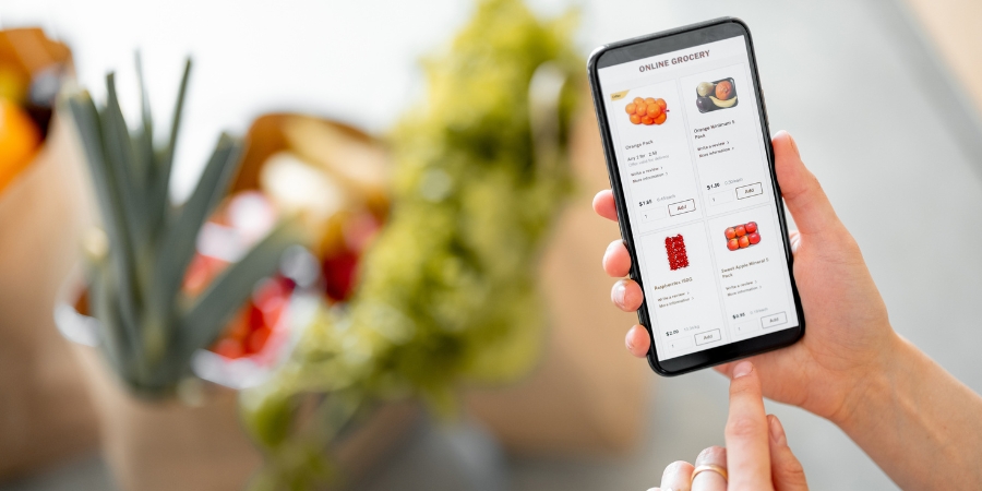 Online Grocery app with groceries out of focus in the background