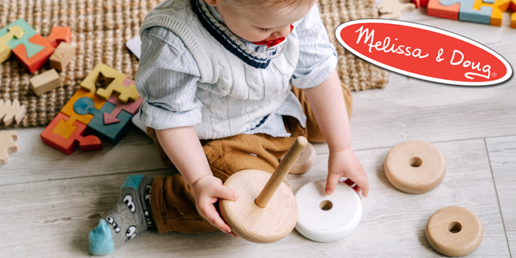 Child playing with wooden toys